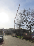 901529 Gezicht op de bouw van nieuwe woningen op het voormalige werkplaatsterrein van de N.S. aan de 2e Daalsedijk te ...